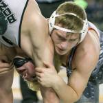 Stanwood&rsquo;s Mason Phillips (right) wrestles Bonney Lake&rsquo;s Mason Sabin for the 3A state championship at 145 pounds on Feb. 18 in Tacoma. Phillips has traveled to Ohio to train as he chases a world championship this summer. (Kevin Clark / The Herald)