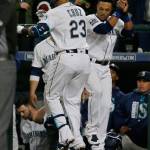Seattle&rsquo;s Nelson Cruz celebrates with Robinson Cano after they hit back-to-back home runs in the first inning of Monday&rsquo;s game in Seattle. (AP Photo/Ted S. Warren)