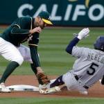 Oakland shortstop Adam Rosales tags out Seattle&rsquo;s Guillermo Heredia at second base during the first inning of Friday&rsquo;s game in Oakland, Calif. (AP Photo/Marcio Jose Sanchez)