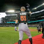 Miami Marlins&rsquo; Ichiro Suzuki tips his cap after being honored by Seattle Mariners players and executives for his 3,000 hit milestone in a pre-game ceremony before a baseball game against the Mariners, his former team, on Monday in Seattle. (AP Photo/Ted S. Warren)