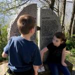 Charlie and Grace Swaney check out the the Fairhaven-Whatcom boundary marker along the South Bay Trail. (Aaron Swaney / The Herald)