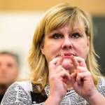 Watching a live stream from Denver, Co., Kathleen Shaman crosses her fingers as she and others wait for the final award announcement in the Americas Best Communities competition on Wednesday, April 19, 2017 in Arlington, Wa. Arlington and DArrington&rsquo;s entry was a finalist but not one of the top three winners. (Andy Bronson / The Herald)
