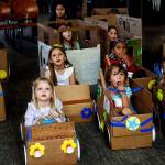 Snohomish area children enjoy watching movies Monday afternoon at the Snohomish Library&rsquo;s &ldquo;My First Drive-in&rdquo; event. The youngsters, 3 years and older, brought cardboard boxes from home and used their arts and crafts skills to transform them into pretend cars to sit in while watching a selection of movie shorts. (Dan Bates / The Herald)