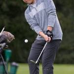 Kamiak&rsquo;s Alvin Kwak chips onto the green Monday during the Dolan Invitational at Everett Golf & Country Club. (Andy Bronson / The Herald)