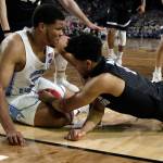 North Carolina&rsquo;s Kennedy Meeks places his right hand out of bounds as Meeks and Gonzaga&rsquo;s Silas Melson (0) battle for a loose ball in the closing minutes of Monday night&rsquo;s championship game of the NCAA men&rsquo;s college basketball tournament in Glendale, Arizona. (AP Photo/David J. Phillip)