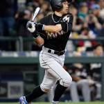Ichiro Suzuki of the Miami Marlins hits a home run against the Mariners in the ninth inning of Wednesday&rsquo;s game at Safeco Field in Seattle. (AP Photo/Elaine Thompson)