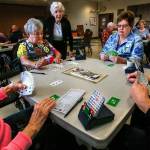 From left in pink sweater: Dolores Lemmon, 82, Mary Ewing, 76, Verna Baker, 89, Sue Rewak, 69, and Paul Ronken, 73, are just a few of the enthusiastic bridge club members who meet and play regularly at the Carl Gipson Senior Center in Everett. (Dan Bates / The Herald)