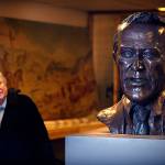 In the basement storage area of Everett&rsquo;s Culmback building in October 2011, Everett Public Library historian David Dilgard walks past a large bronze sculpture of the late Sen. Henry M. &ldquo;Scoop&rdquo; Jackson. (Dan Bates / The Herald)