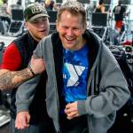 Firmly in the grip of his assistant, Kacey Walker, Stanwood&rsquo;s Todd Duitsman, who has been paralyzed since a 2014 body surfing accident on Maui, stands up from his wheelchair and attempts a step forward Wednesday at the Marysville YMCA. (Dan Bates / The Herald)