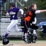 Lake Stevens&rsquo; Camryn Dubois scores a run as Monroe&rsquo;s Taylor Durant points to second base during Monday&rsquo;s game in Lake Stevens. (Andy Bronson / The Herald)