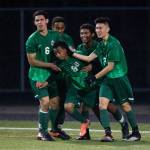 Edmonds-Woodway&rsquo;s Simon Ghebreamiak, (9) is congratulated by teammates after scoring a goal during a game against Lynnwood on April 5, 2017, in Bothell. (Andy Bronson / The Herald)