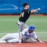 Lynnwood&rsquo;s Kyler McMahan turns a double play after forcing Shorewood&rsquo;s Arthur Pate out at second base during a game on April 4, 2017, in Shoreline. Lynnwood won 3-2 in nine innings. (Andy Bronson / The Herald)