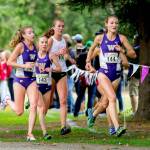 Amy-Eloise Neale of the University of Washington (144) leads the pack during the Washington Invitational cross countrymeet in October at Jefferson Park Golf Course in Seattle. (Scott Eklund / Red Box Pictures)