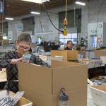 Caroline Powers and Amy Tibet&rsquo;s, right, work at Orion Industries, a non-profit that combines commercial work with a social mission, in 2016 in Mukilteo. (Andy Bronson / The Herald)