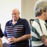 Patrick Shunn, the namesake uncle of murder victim Patrick Shunn, looks at Tony Reed (right) after asking the court to hand down a long sentence for Reed at the Snohomish County Courthouse on Monday in Everett. Reed was sentenced to 14 months in jail with time served for helping his brother dispose of the bodies of Shunn and Monique Patenaude of Oso. (Andy Bronson / The Herald)