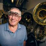 Ben Gary repairs the dings and dents of the Husky Marching Band at the University of Washington. (Quinn Russell Brown)