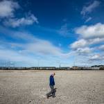 Bryan Lust, site manager for Kimberly-Clark, walks across the 67-acre former site of the company&rsquo;s Everett mill on Thursday, March 23. (Ian Terry / The Herald)