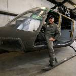 Snohomish County Sheriff&rsquo;s Search & Rescue chief pilot Bill Quistorf sits in the stripped-out body of Kiowa helicopter April 19 in Snohomish. Search & Rescue is turning an old helicopter body into an outdoor-safety display for fairs and festivals. (Andy Bronson / The Herald)