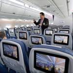 An Airbus employee describes the passenger cabin of a new Airbus A350 XWB passenger plane at Newark Liberty international airport in Newark, New Jersey, in 2015. Airbus says production delays persist on the twin-aisle A350. (AP Photo/Mel Evans)