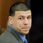 Former New England Patriots tight end Aaron Hernandez turns to look in the direction of the jury as he reacts to his double-murder acquittal in Boston on Friday. Hernandez hung himself in prison early Wednesday, according to officials. (AP Photo/Stephan Savoia, Pool, File)