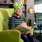 Author Julia Donaldson, in a Jumperee frog hat, reads a story. (Photo courtesy of Penguin Young Readers)