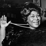 American jazz singer Ella Fitzgerald swings her necklace as she arrives at the Carlton Theatre in London on Feb. 22, 1968. (Bob Dear / AP file)