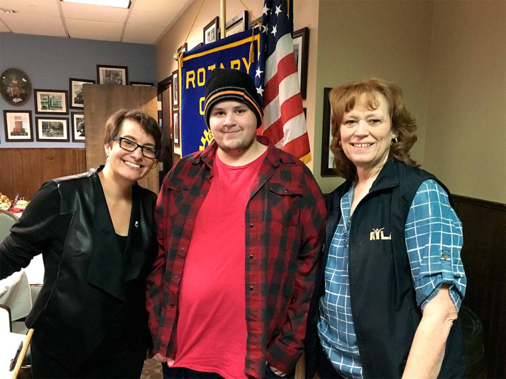 South Everett-Mukilteo Rotary Club President Cassie Franklin (left) and Linda Murray (right) congratulate ACES High School&rsquo;s Hunter Lankford on being named a Student of the Month. (Contributed photo)