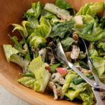 A boring green salad with chicken is renewed with apple, maple walnuts and buttermilk dressing. (Goran Kosanovic for The Washington Post)