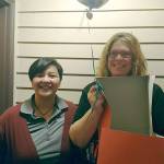 WGU Washington mentor Jen Liptrap (left) surprises Paula Kohring at her Everett apartment with the news that Kohring was chosen to receive a $10,000 scholarship. (Contributed photo)