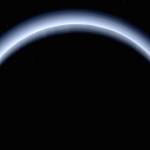 Pluto is illuminated from behind by the sun as the New Horizons spacecraft travels away from it at a distance of about 120,000 miles. (NASA)