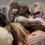 People including Carol Bundy (top center), wife of Nevada rancher Cliven Bundy, embrace after a partial verdict outside of the federal courthouse on Monday in Las Vegas. A jury found two men guilty of federal charges in an armed standoff that stopped federal agents from rounding up cattle near Cliven Bundy&rsquo;s Nevada ranch in 2014. (AP Photo/John Locher)