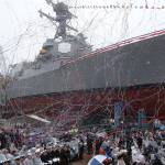 Confetti and streamers fly as the future USS Thomas Hudner, a U.S. Navy destroyer named after Korean War veteran Thomas Hudner, is christened at Bath Iron Works in Bath, Maine, on Saturday. (AP Photo/Mary Schwalm)