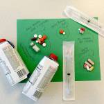 The daily medications needed to treat someone with tuberculosis: injections, pills, vitamins and nutritional drinks. (Snohomish Health District)