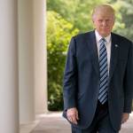 President Donald Trump walks along the West Wing Colonnade at the White House on Friday. (AP Photo/Andrew Harnik)
