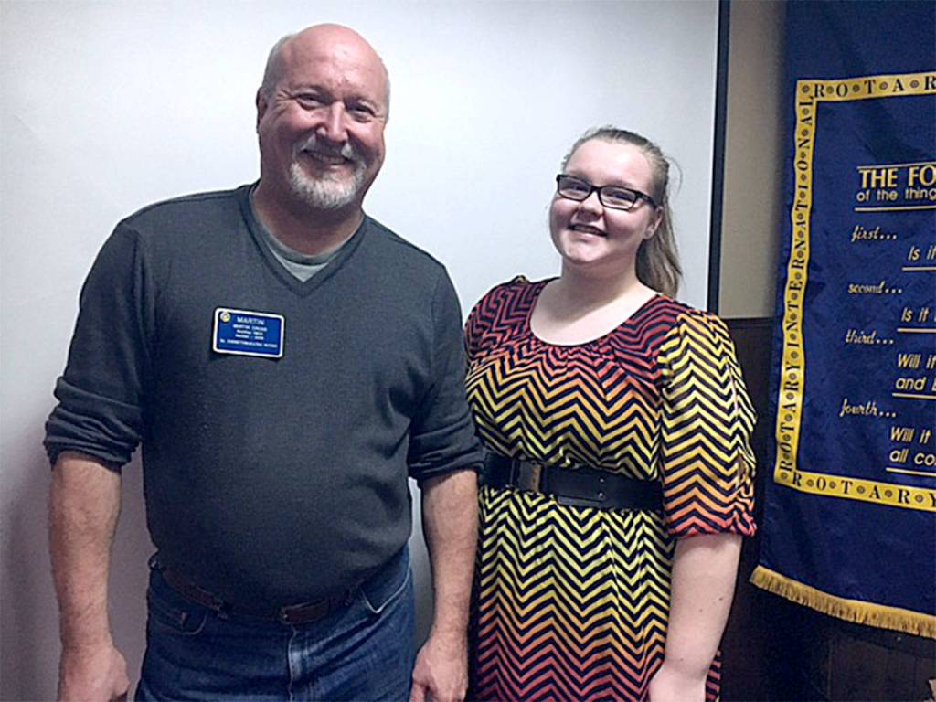 South Everett-Mukilteo Rotary Club past president Martin Cross congratulates Mariner High School&rsquo;s Victoria Philp as a Student of the Month. (Contributed photo)