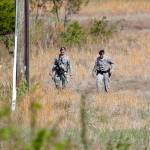 Air Force Security officers patrol the area near the location where a military aircraft crashed Wednesday, April 5, in Clinton, Maryland. (AP Photo/Pablo Martinez Monsivais)