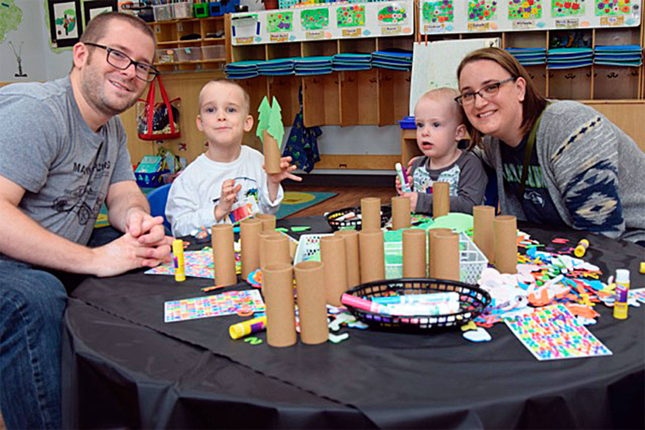 The Sheriff family, from left Scott, Van, Lee and Darcy, enjoy an art-themed fundraiser for The Moyer Foundation at The Goddard School, a Snohomish preschool. (Contributed photo)