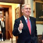 Senate Majority Leader Mitch McConnell of Kentucky signals a thumbs-up as he leaves the Senate chamber on Capitol Hill in Washington on Thursday, April 6, after he led the GOP majority to change Senate rules and lower the vote threshold for Supreme Court nominees from 60 votes to a simple majority in order to advance Neil Gorsuch to a confirmation vote. (AP Photo/J. Scott Applewhite)