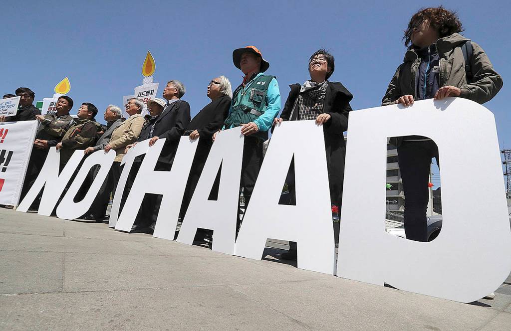Protesters hold letters reading &ldquo;NO THAAD&rdquo; during a rally to oppose a plan to deploy an advanced U.S. missile defense system called Terminal High-Altitude Area Defense, or THAAD, near U.S. Embassy in Seoul, South Korea, on Wednesday, April 26. In a defiant bit of timing, South Korea announced Wednesday that key parts of a contentious U.S. missile defense system had been installed a day after rival North Korea showed off its military power. (AP Photo/Lee Jin-man)