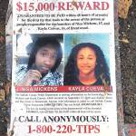 In this Sept. 27, 2016 photo, a poster featuring photos of Nisa Mickens and Kayla Cuevas is part of a memorial near the spot where their bodies were found in Brentwood, New York. The girls, who were best friends, were found murdered. (AP Photo/Claudia Torrens, File)