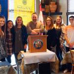 Monroe Rotary Club President Sam Wirsching (center) honors students from Monroe and Sultan, from left, Cierra Mattern, Sammy Chu, Anyssa Ruiz, Grace Low, DeAnna Wesson and Kyle De La Fuente as Students of the Month. (Contributed photo)