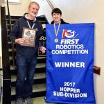 Arlington High School NeoBots mentor Mark Ehrhardt and treasurer Burch Walker show the awards the team earned during the FIRST Robotics Competition April 19-22 in Houston, Texas. (Contributed photo)