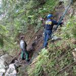 In this undated photo, investigators work near the wreckage of a sightseeing plane that crashed June 25, 2015, in remote, mountainous terrain near Ketchikan in southeast Alaska, killing the pilot and eight passengers. The NTSB on Tuesday, April 25, said the pilot&rsquo;s decision to fly using visual flight rules when conditions called for instrument rules was a cause of a fatal crash of the sightseeing flight. (National Transportation Safety Board via AP, File)