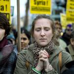 A protester reacts during a rally against the U.S. missile strikes in Syria on Friday, April 7, in New York. (AP Photo/Andres Kudacki)