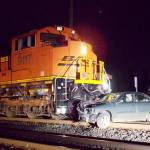 An abandoned car was hit by a train in Monroe late Friday. (Monroe Police)
