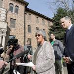 In this file photo taken April 11, Western State Hospital CEO Cheryl Strange addresses members of the media in front of the facility as Gov. Jay Inslee looks on, in Lakewood. (AP Photo/Elaine Thompson, File)