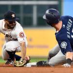 The Mariners&rsquo; Mitch Haniger (17) slides safely into second for a double in front of Astros second baseman Jose Altuve during the fourth inning of a game April 4, 2017, in Houston. (AP Photo/Eric Christian Smith)