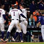 The Astros&rsquo; George Springer (front right) is mobbed by teammates after hitting a game-winning three-run home run off Mariners relief pitcher Chase DeJong (35) during the 13th inning of a game April 5, 2017, in Houston. (AP Photo/Eric Christian Smith)