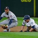 Astros first baseman Yuli Gurriel (left) looks to the infield after tagging out the Mariners&rsquo; Kyle Seager in a rundown between first and second bases during the sixth inning of a game April 11, 2017, in Seattle. (AP Photo/Ted S. Warren)