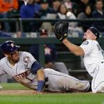 Mariners relief pitcher Dan Altavilla watches the ball pop loose from his glove as the Astros&rsquo; Carlos Correa scores on a wild pitch in the seventh inning of a game April 12, 2017, in Seattle. (AP Photo/Elaine Thompson)